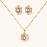 Ornate gold-plated jewelry set featuring peach center stone surrounded by clear AAA cubic zirconia crystals