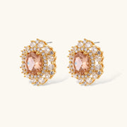 Ornate gold-plated jewelry set featuring peach center stone surrounded by clear AAA cubic zirconia crystals