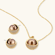 Gold-plated spherical jewelry set with zirconia crystals, featuring dome-shaped pendant and matching stud earrings.