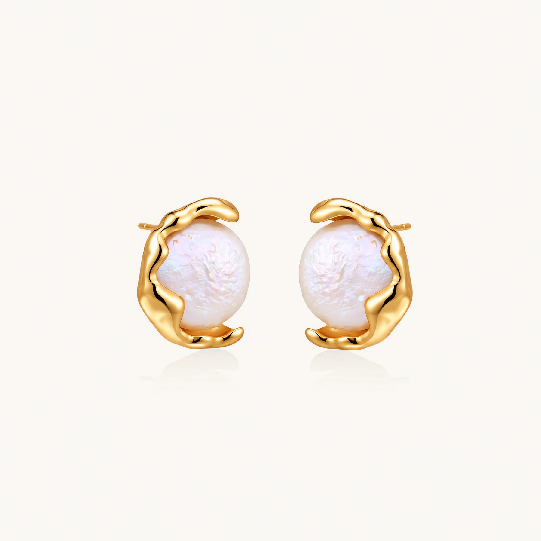 Gold vermeil studs with lustrous pink freshwater pearls in organic crescent settings