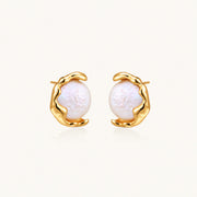 Gold vermeil studs with lustrous pink freshwater pearls in organic crescent settings