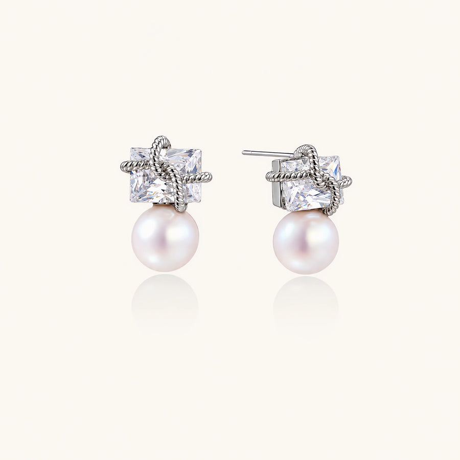 White gold stud earrings with square crystal stones in twisted frames and pink freshwater pearl drops below