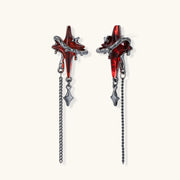 Gothic red resin dagger earrings with silver chain details and S925 posts on white background