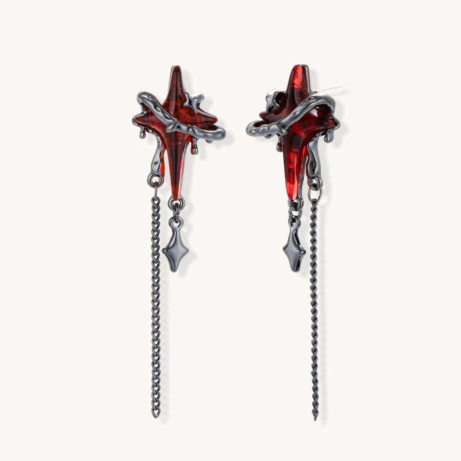 Gothic red resin dagger earrings with silver chain details and S925 posts on white background