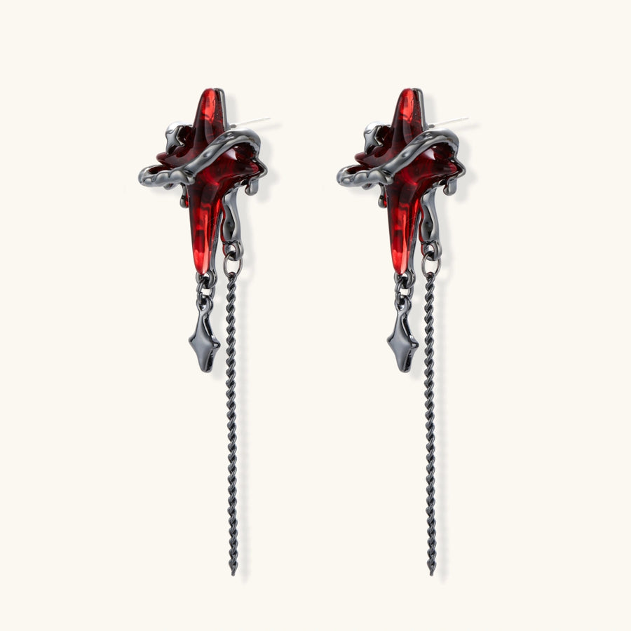 Gothic red resin dagger earrings with silver chain details and S925 posts on white background