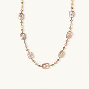 Iridescent baroque pearls alternating with small freshwater pearls on 14K gold-plated chain